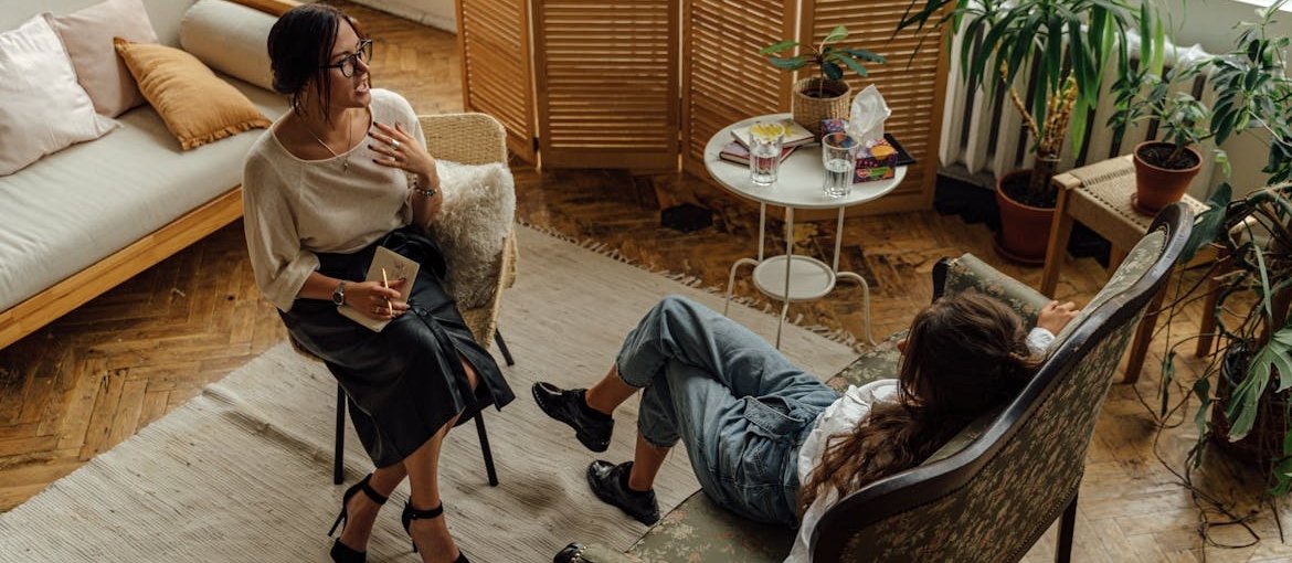 Woman talking about can an alcoholic ever drink again with her therapist.