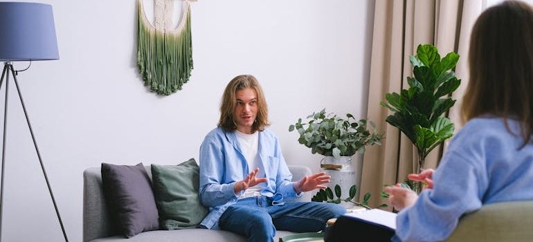 Therapist explaining principles of CBT to a patient.