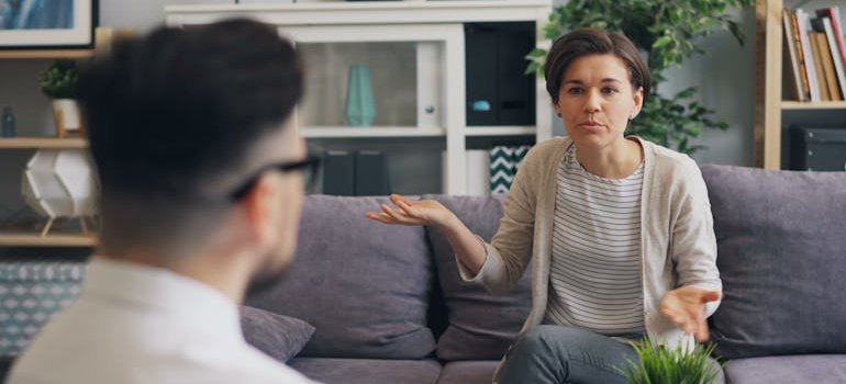 Therapist explaining principles of CBT to a patient.