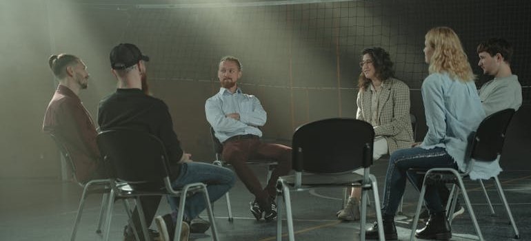 People in a support group talking about a relapse prevention plan.