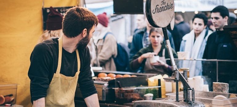 Man working in a fast food booth.