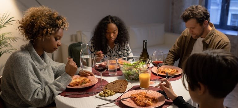 Family having dinner and feeling the devastating impact of substance use on families.