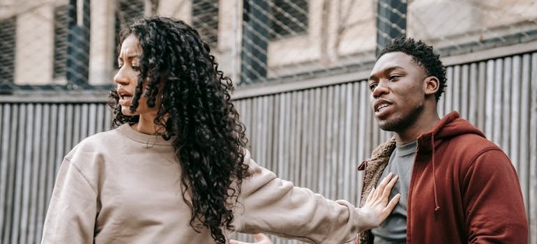 Woman walking away from her partner after having an argument.