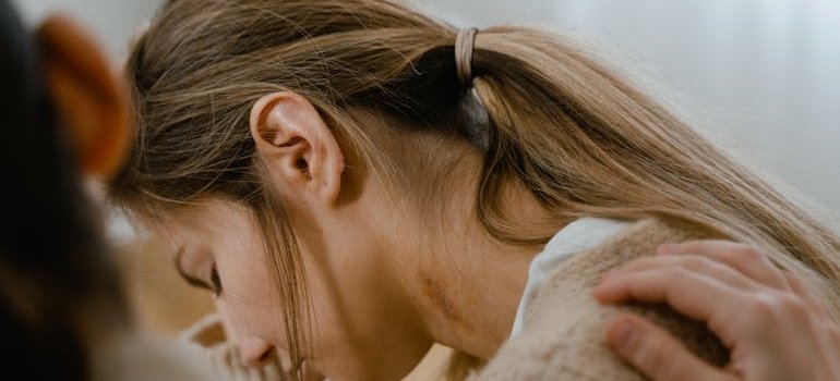 Woman supporting her sad friend through a hard time.