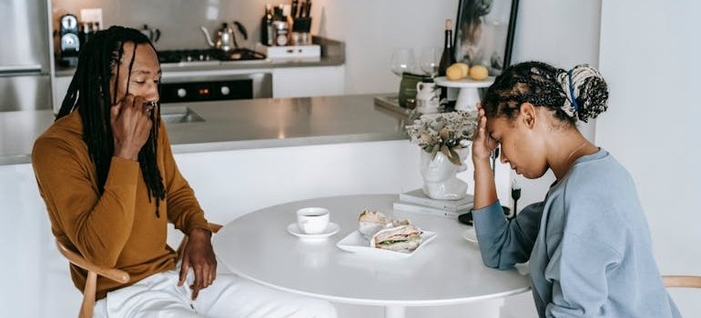 Siblings sitting at a table after having a conversation about boundaries.