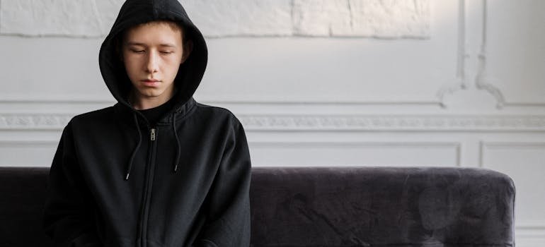 Young man thinking about how to develop self-esteem.