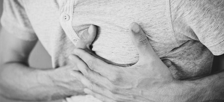 Man experiencing chest pain due to prescription medication overdose.