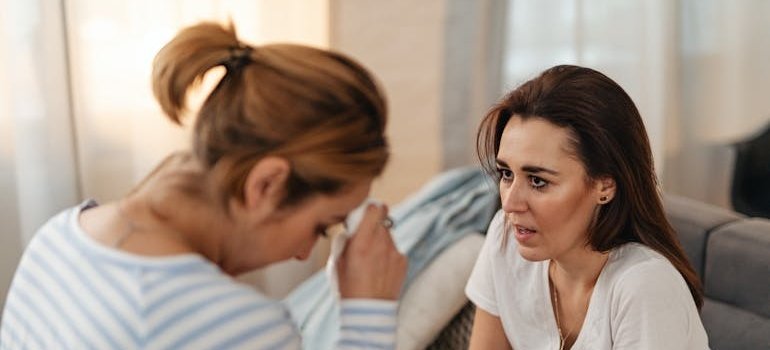 Woman talking about signs and symptoms of Adderall abuse with her loved one.