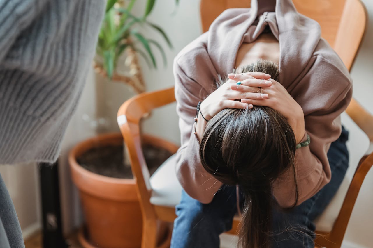 Anxious woman worrying about how long does weed paranoia last.