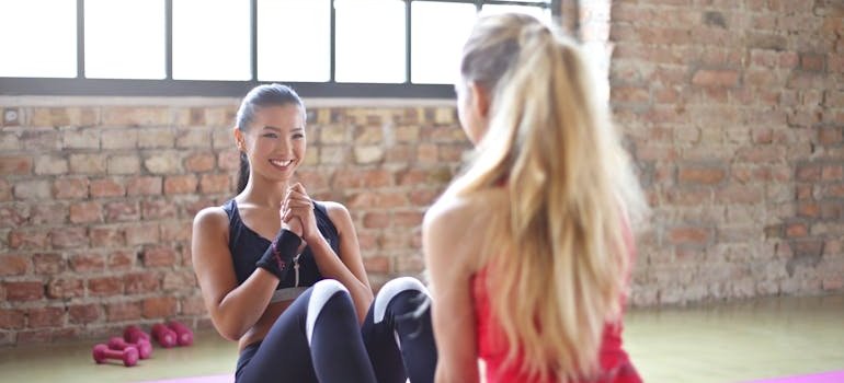 Two women exercising together.