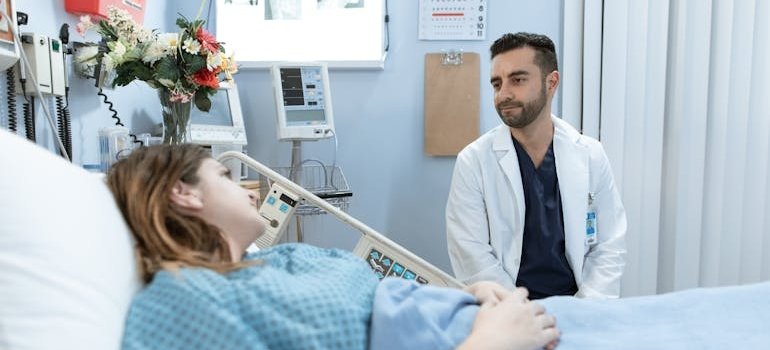 Doctor talking about an benzodiazepines overdose with a patient lying in a hospital bed.