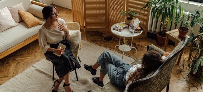 Therapist talking with her patient.