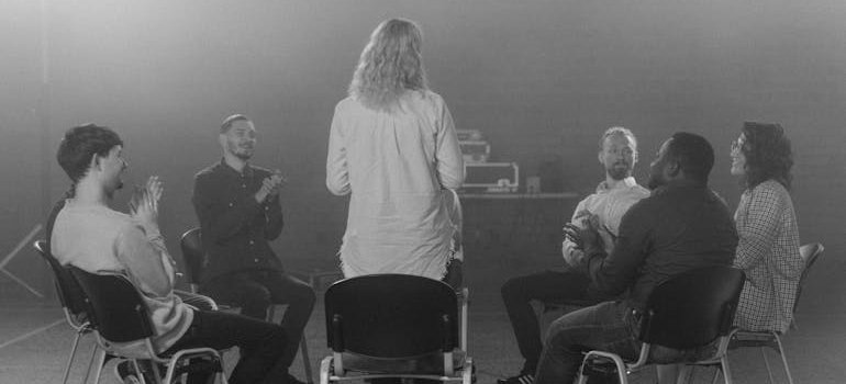 Woman sharing her story in a peer support group.