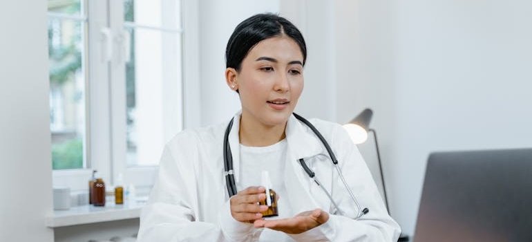 Doctor talking to a patient about prescription medication overdose in an online consultation.