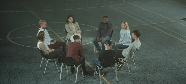 People in group therapy learning about establishing healthy boundaries in recovery.