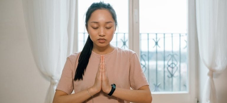Woman doing yoga to help rebuild a healthy mind and body.