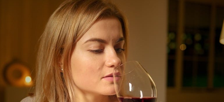 Woman drinking a glass of wine.