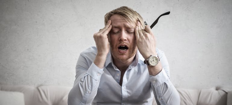 Man having a headache from stress.