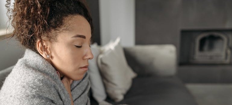 Woman feeling sick while struggling with physical vs psychological dependence.