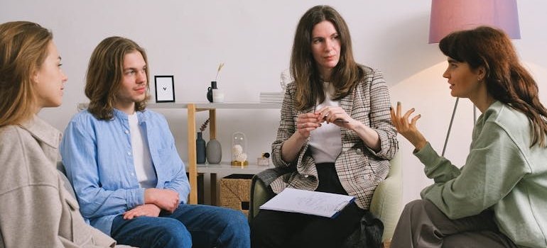 People in group therapy discussing their issues with situational depression.