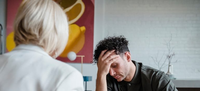 Man talking about her struggles with OCD and trauma with her therapist.